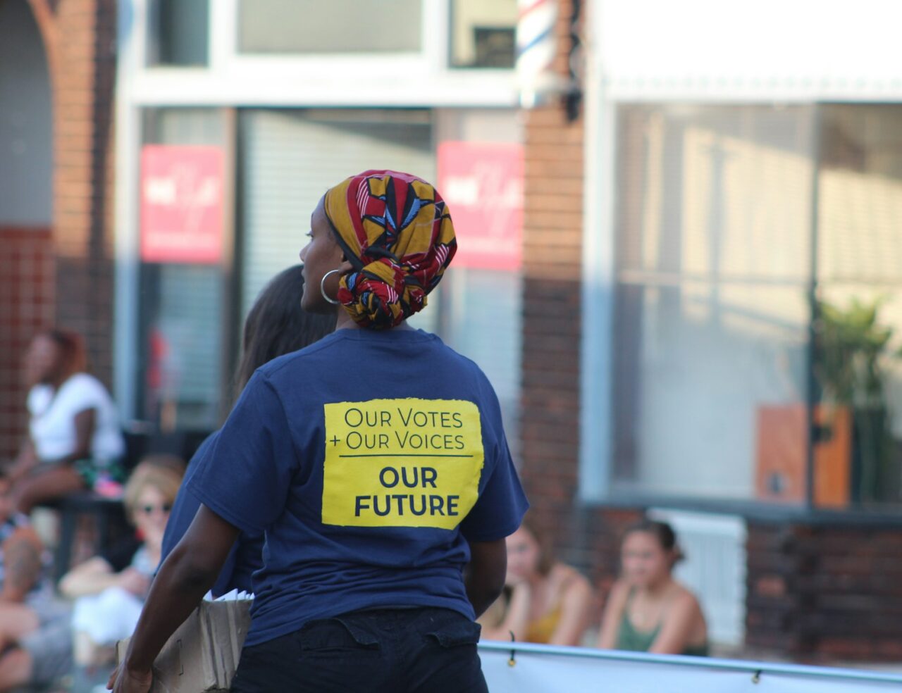 woman wearing blue and yellow crew-neck shirt